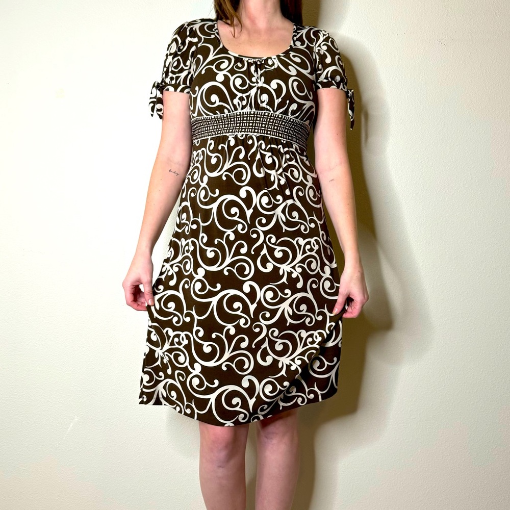 Enron’s brown and white dress